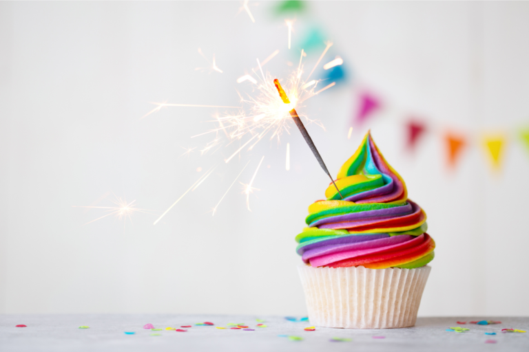 Rainbow cupcake with a sparkler