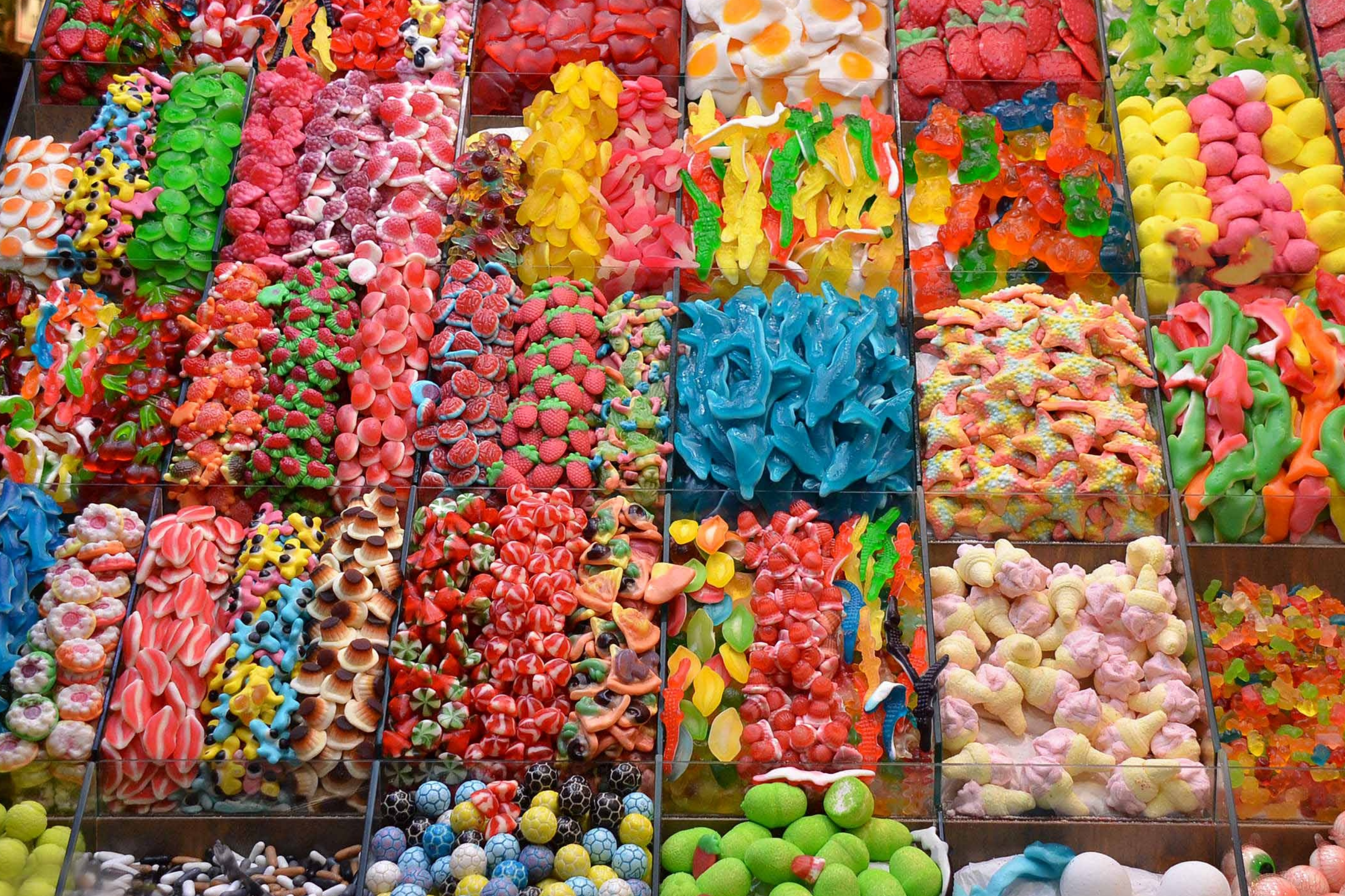 Various colorful lollies in lolly shop. 