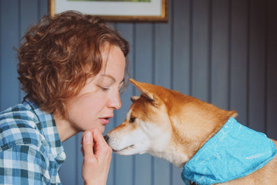 Woman and dog learning new trick